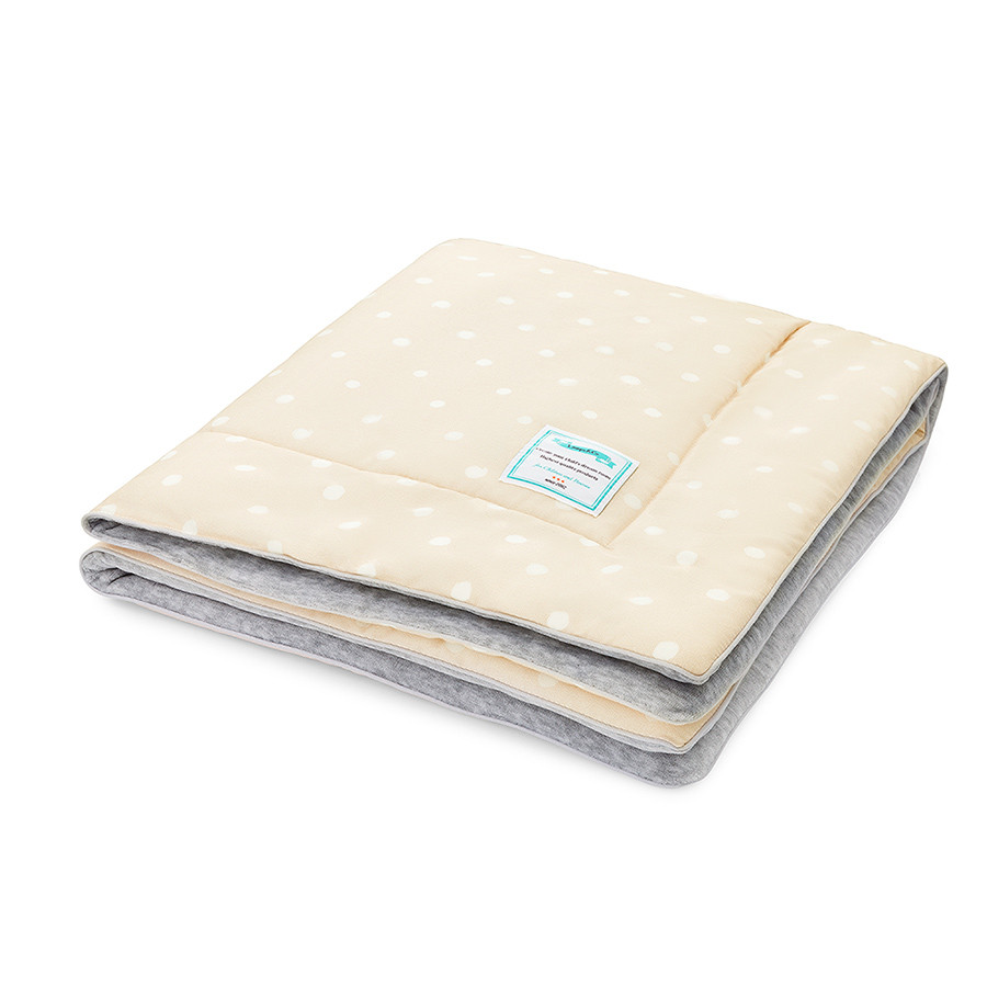 Couverture beige chaude à pois Couverture beige chaude à pois